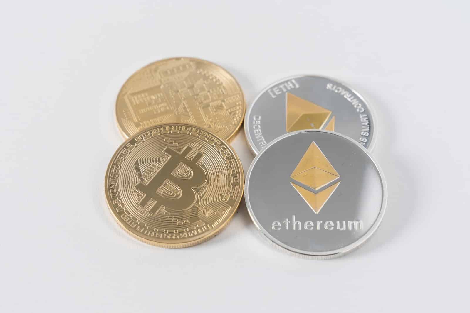 four round silver-colored and gold-colored Bitcoins