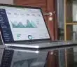laptop computer on glass-top table